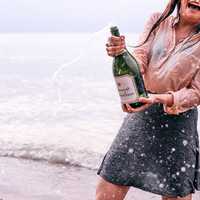 celebrating-with-a-bottle-of-wine-at-the-seashore