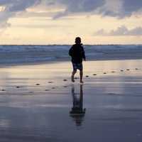 child-running-on-the-beach-near-the-sea