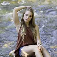 country-girl-sitting-on-a-rock