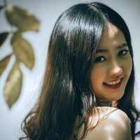 cute-asian-model-looking-back-and-smiling