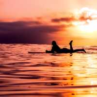 female-surfer-silhouette-on-the-ocean