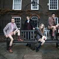 four-young-people-sitting-on-bench