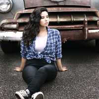 girl-in-front-of-rusted-car
