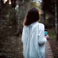 girl-in-white-shirt-walking-in-the-woods