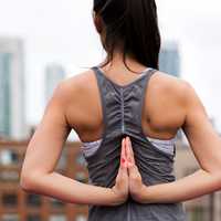 girl-making-symbol-hands-behind-back