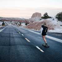 girl-skateboarding-down-the-road