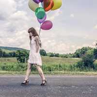 Girl with white dress and Balloons