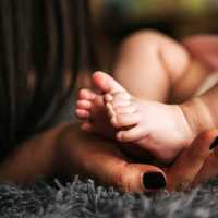 hands-holding-baby-feet