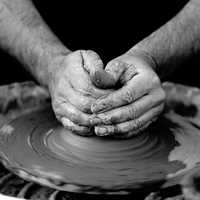 hands-working-clay-making-pottery
