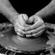 hands-working-clay-making-pottery