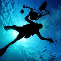 human-with-camera-underwater