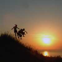 jumping-down-the-hill-at-sunset