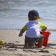 kid-on-the-beach-building-sand-castle