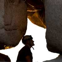 looking-through-a-rock-hole-at-a-climber