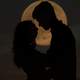 man-and-woman-silhouette-kissing-in-the-moon