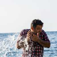 Man being splashed by water