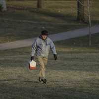 man-carrying-lunchbox-walking