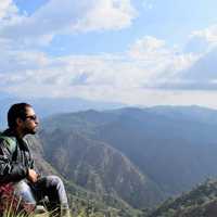 man-in-high-mountains-looking-at-sky