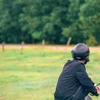 man-in-motorcycle-helmet-facing-backwards