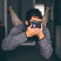 man-taking-a-photo-with-nikon-camera