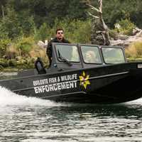 Officer in Patrol Boat on the water