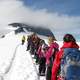 people-climbing-a-mountain-in-the-snow