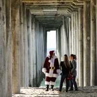 people-meeting-santa-claus-in-the-corridor