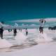 people-standing-on-top-of-salt-mounds