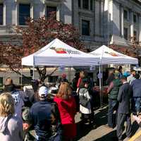 USDA Farmers Market celebrates the close of its 22nd season on Oct 27, 2017, in Washington, DC The last market day featured live music from the U.S. Army Band, farm animal exhibits. Visitors were able to bowl with squash, help harvest and learn about sweet potatoes for DC Central Kitchen, pick and paint pumpkins, meet farm animals, shop for fresh picked local produce from the Chesapeake Bay Region, enjoy prepared foods, see live turkeys from Tall Cotton Farm, get a farm animal and veggie-themed temporary tattoo to wear, and shop for food inspired art work. “VegU” Program Coordinators prepared and talk about a pumpkin curry soup recipe during free 10-minute fruit and vegetable classes at the “VegU(cation)” tent where people learned how to how to pick, store, and prepare pumpkin curry soup. Fruits and vegetables are featured during their peak harvest time.The USDA farmers market is located on the corner of 12th Street and Independence Ave, SW; features live music, 30+ farmers, ranchers, and small business owners in the Chesapeake Bay Region. The festival played host to thousands of visitors from around America and looks to open May 4, 2018. For more information visit usda.gov/farmersmarket or follow @USDA_AMS on Twitter and Instagram using hashtag #USDAFarmersMkt. View photos of the market on Flickr. USDA Photo by Lance Cheung.