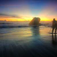 photographer-by-the-seaside-at-sunset