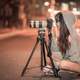 photographer-sitting-on-the-road-taking-a-photo-at-night