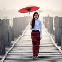 pretty-asian-in-the-rain-with-red-umbrella