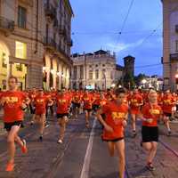 Runners wearing red shirts in a race
