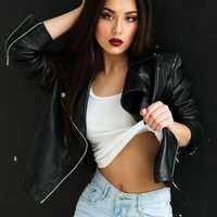 sexy-female-model-in-black-leather-jacket-and-ripped-jeans