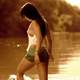 sexy-wet-woman-stepping-into-lake