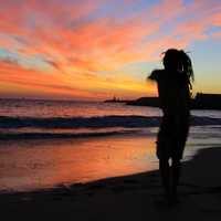 Shadow dancing on the beach on the ocean