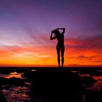 silhouette-of-a-woman-standing-in-the-seashore