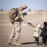soldier-giving-kids-apple
