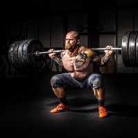 strong-man-squatting-lot-of-weight