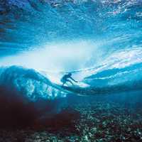 Surfer under the waves