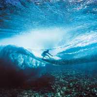 Surfer under the waves