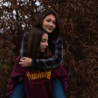 two-girlfriends-playing-piggyback-ride