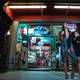 two-girls-standing-outside-ice-cream-shop