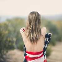 woman-back-wrapped-in-american-flag