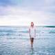 woman-dress-in-white-standing-in-the-sea