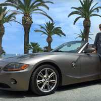 woman-next-to-a-convertible-sports-car