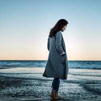 woman-on-the-beach-in-a-coat