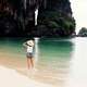 woman-standing-in-the-shallow-water-at-the-beach