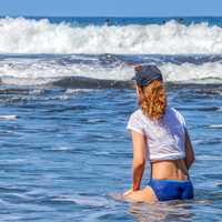 Woman standing in the waves