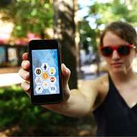 Woman with crypto symbols on phone